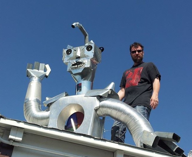 Wes installing Friendly Lord Zondar on the roof of Studio 23